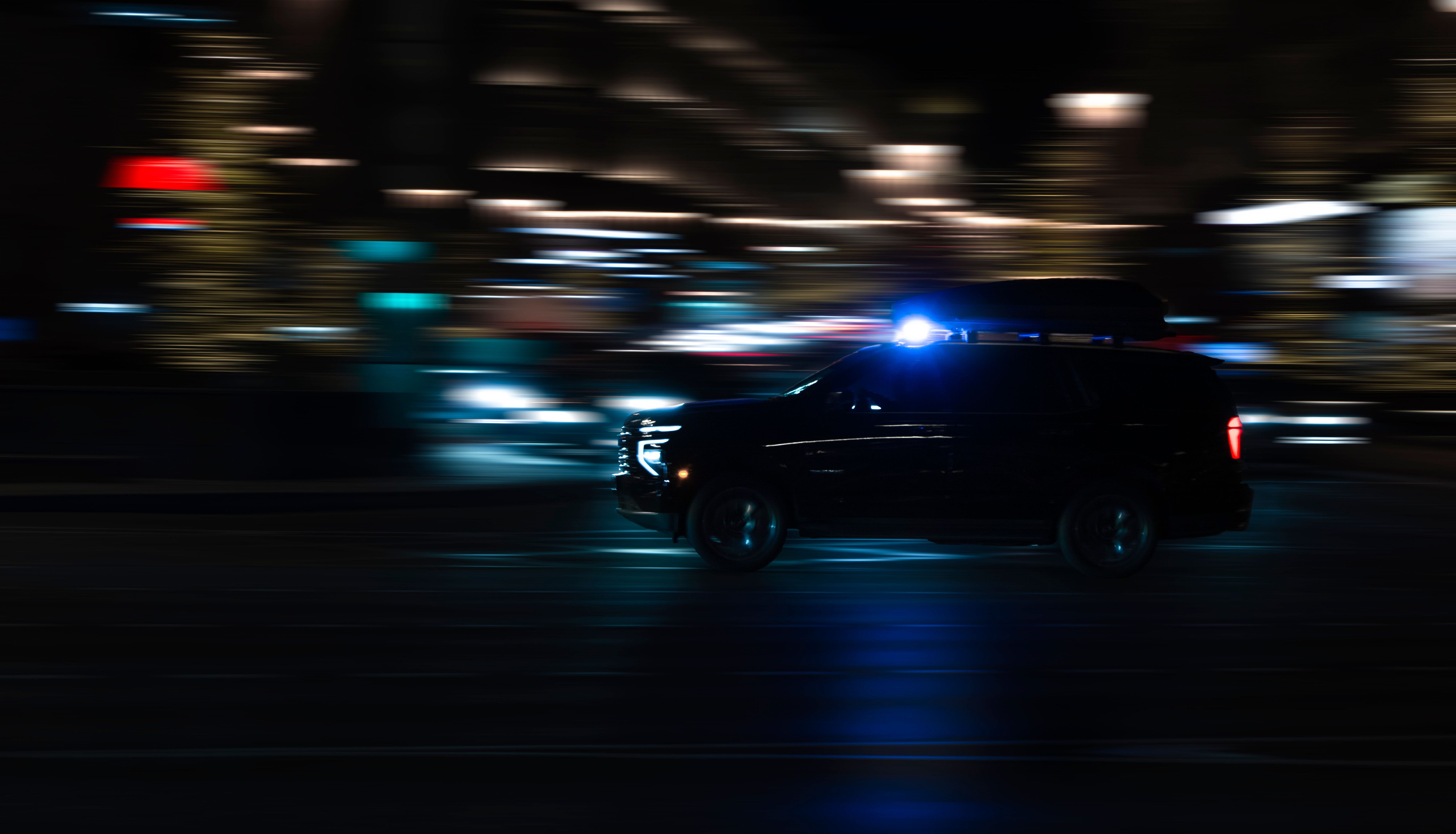 Premium black SUV in motion at night
